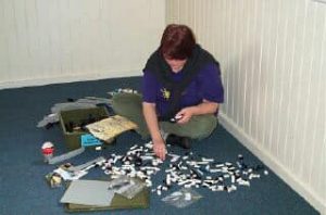 Sue Ann Barber building a LEGO Monorail at the Melbourne National Meet, June 10th, 2001. Photo by Ross Crawford